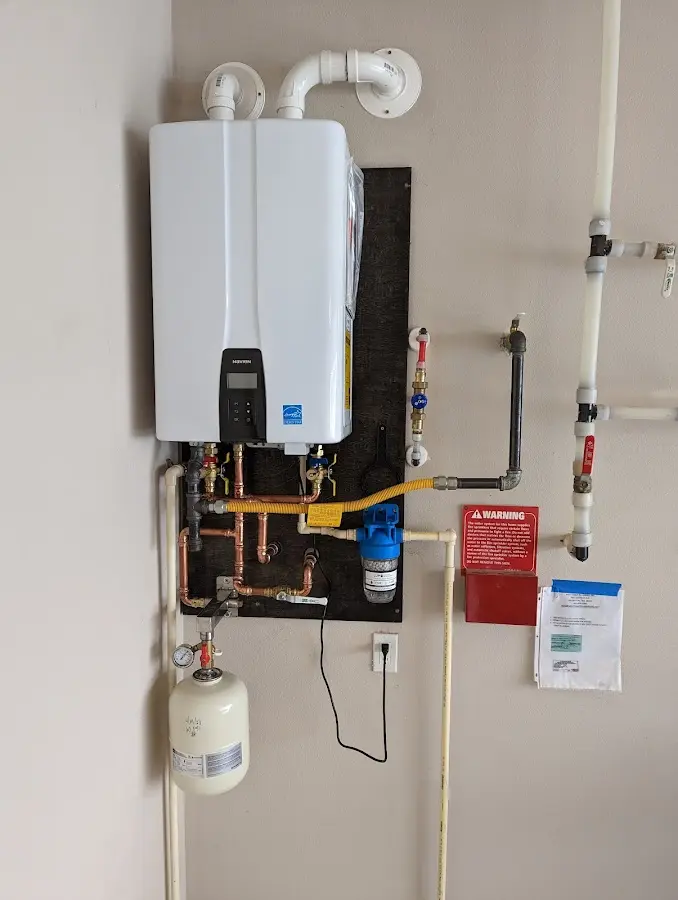 Professional plumber installing copper piping in a Cutten home